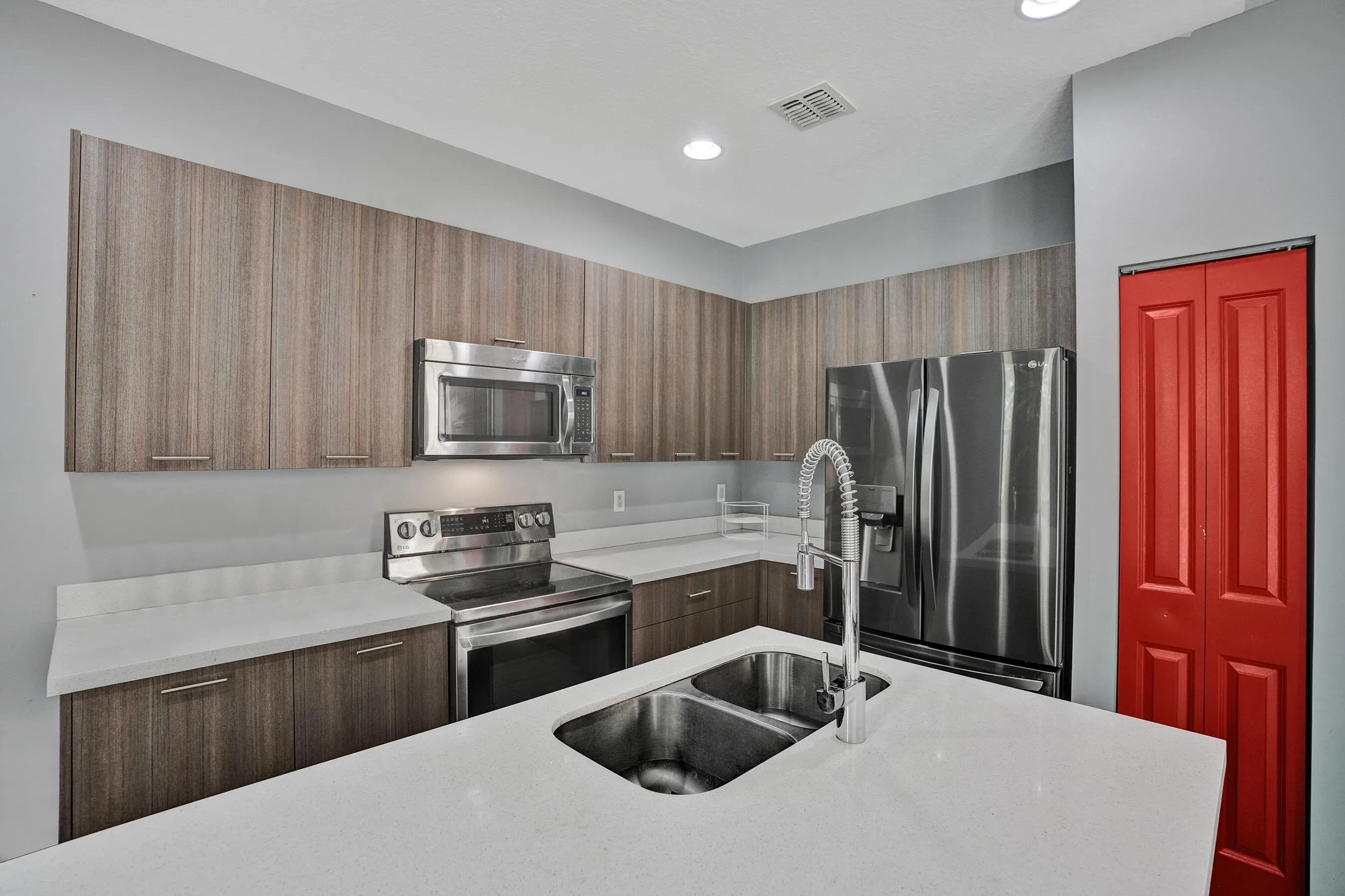 Upgraded appliances, beautiful island with seating, pantry for storage.