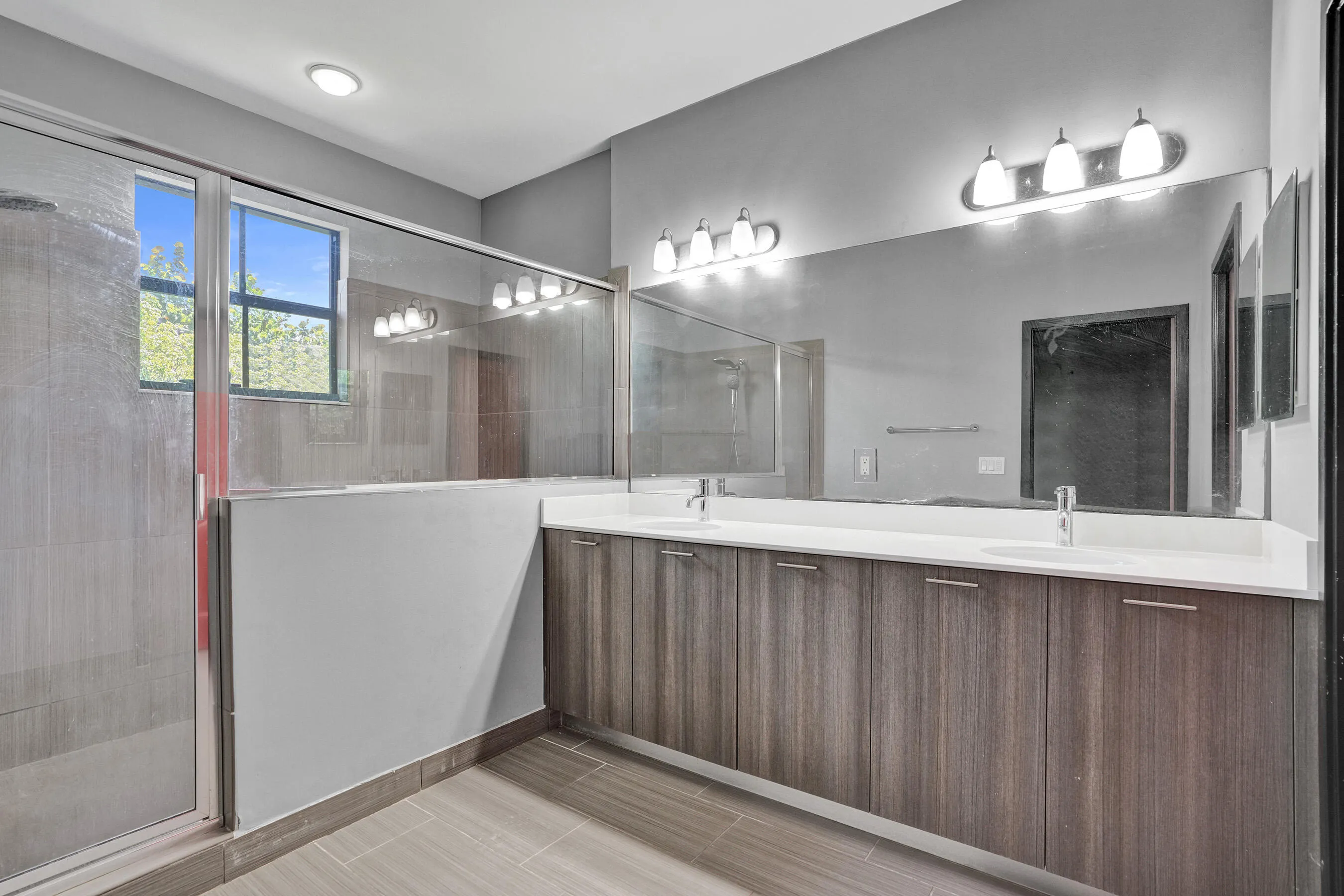 Oversized Shower, Dual Sinks, Ample Storage Space, Upgraded Cabinetry
