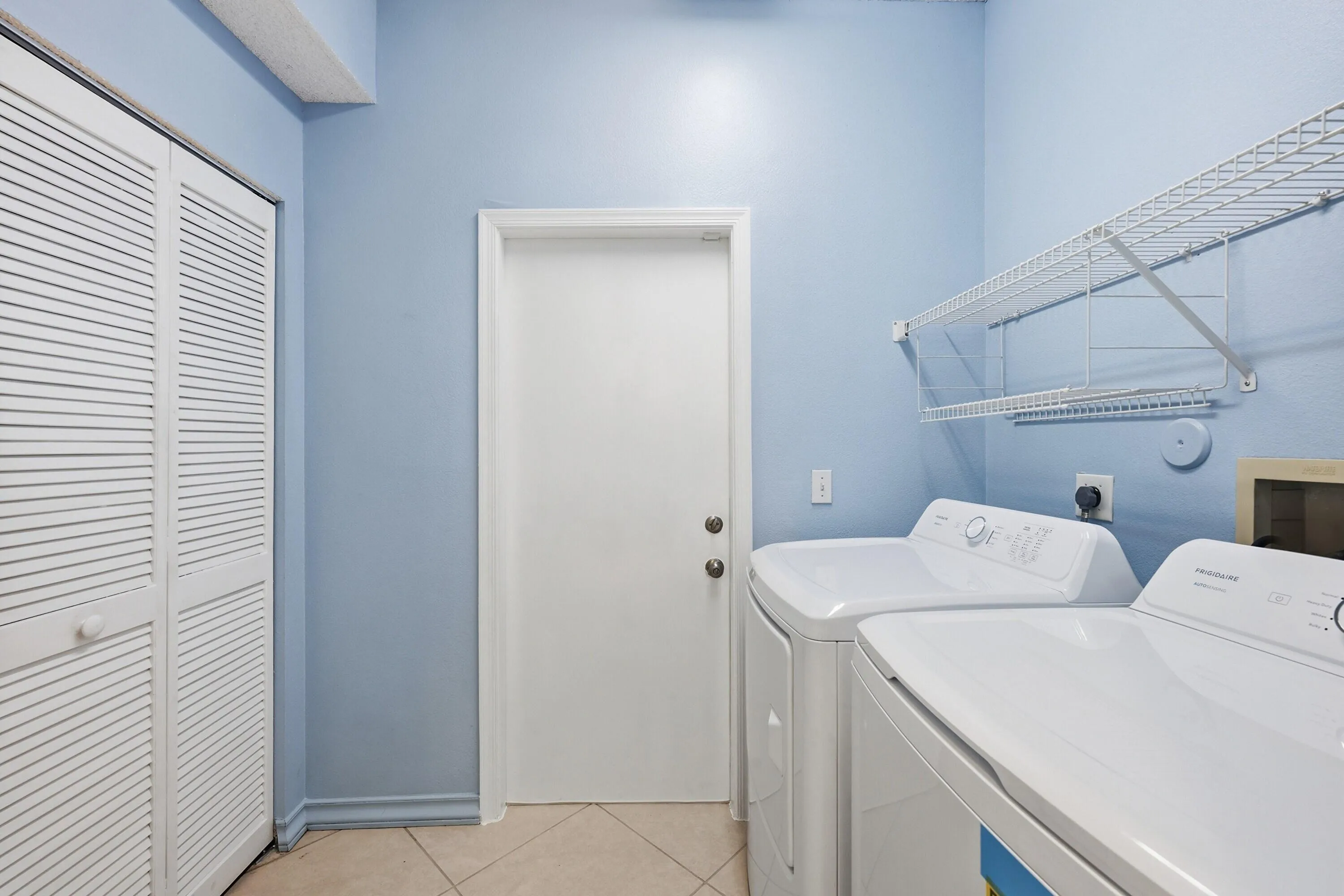 Ground floor laundry room leading into garage