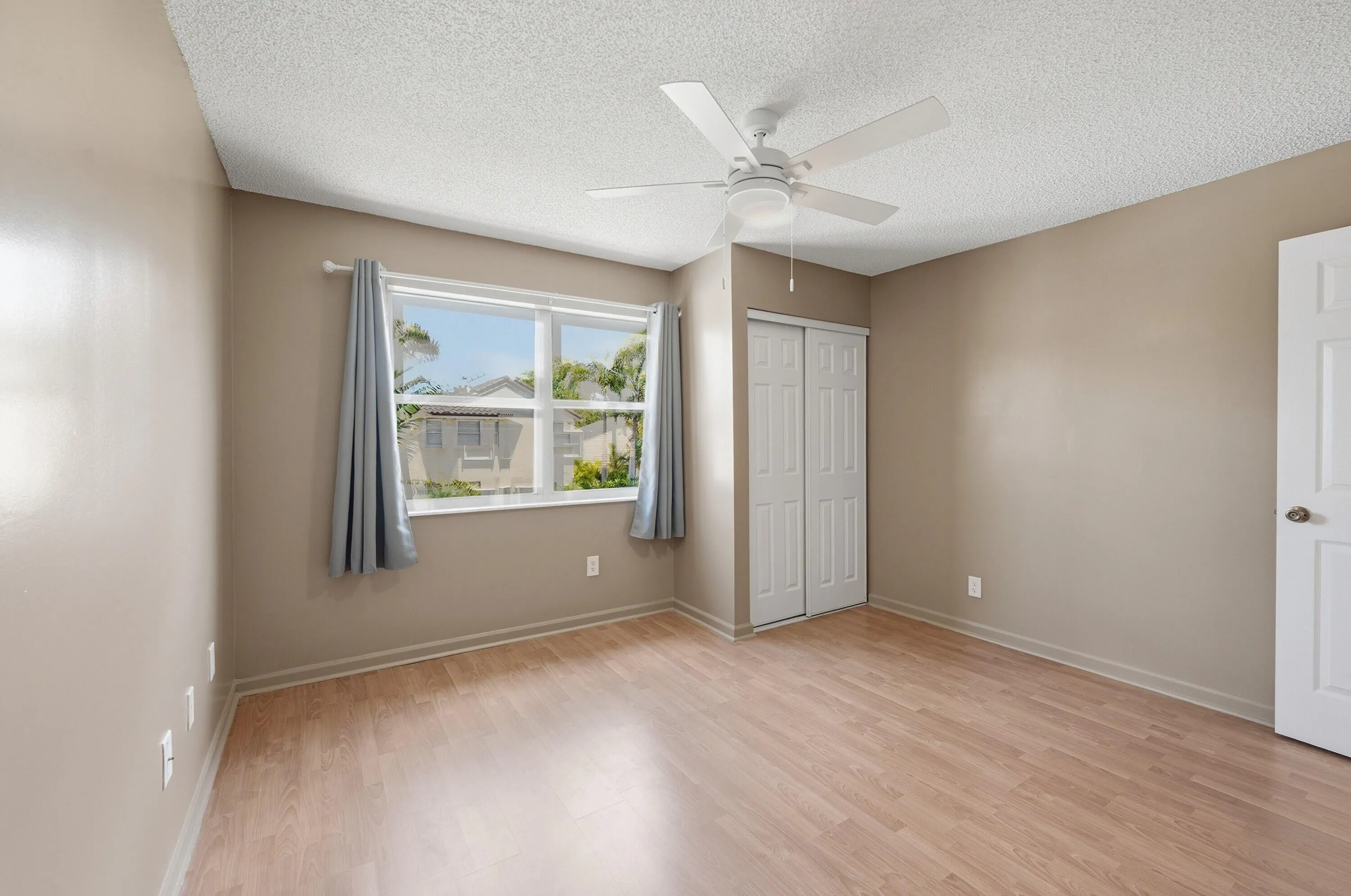 Large second bedroom facing over the backyard