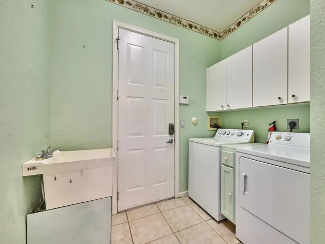 Sink, storage, washer and dryer. Garage Access