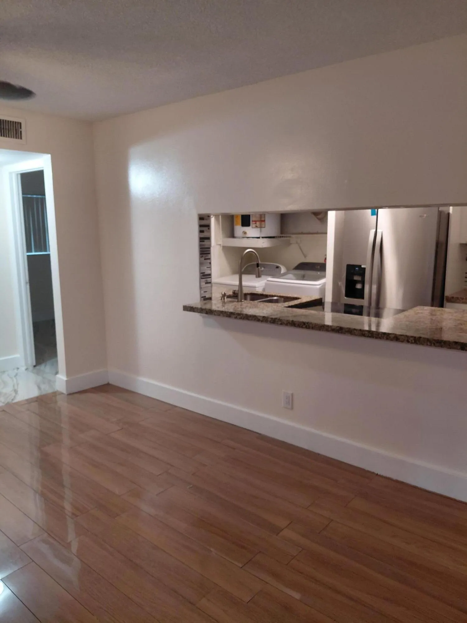 GIFFRARD VIED OF KITCHEN FROM LIVINGROOM