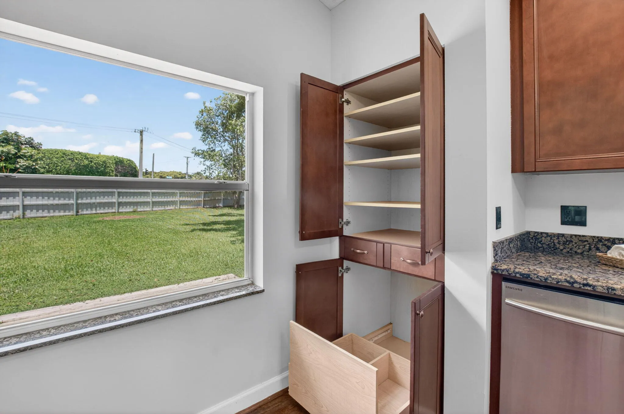 Kitchen showing pantry cabinet features