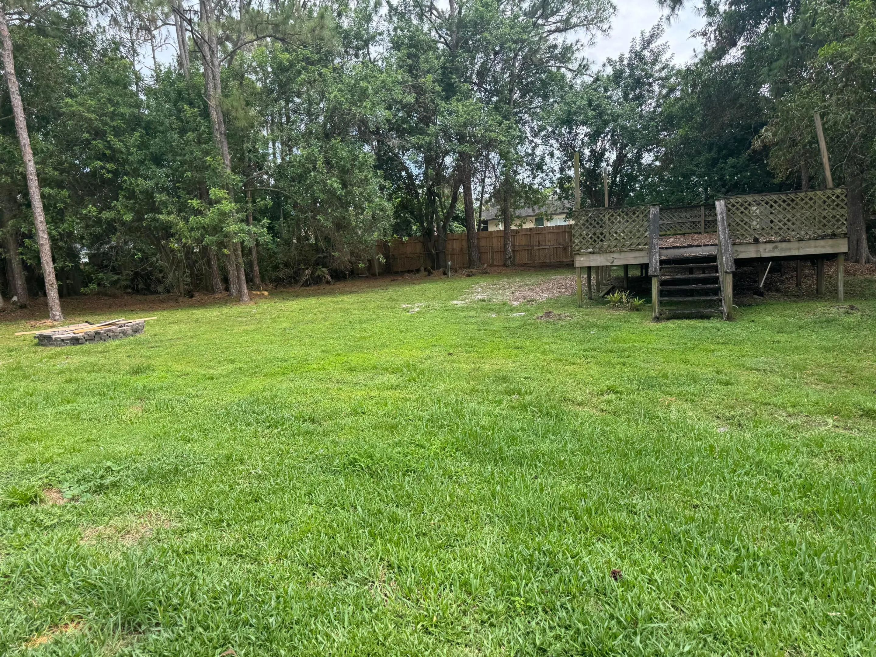 Prior resident built this deck for an above pool. However it needs to be either taken down or fixed. The good news it has electric so could easily build a detatched garage and make the original detatched garage a guest house. Lots of options