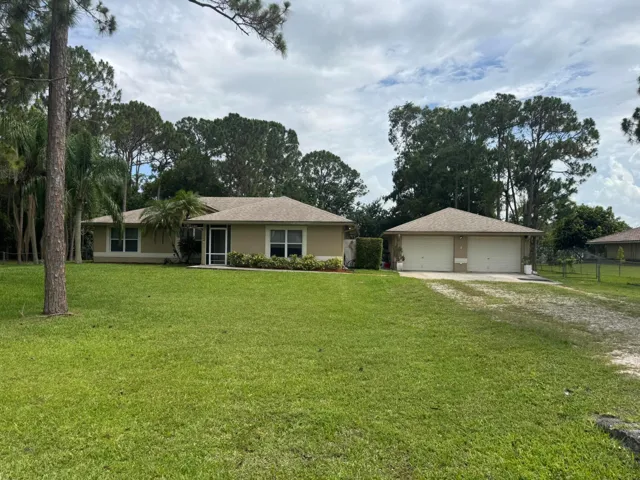 Great Location on Pavement, large backyard fully fenced. One lot off Coconut & 68th. Surrounded by nice homes