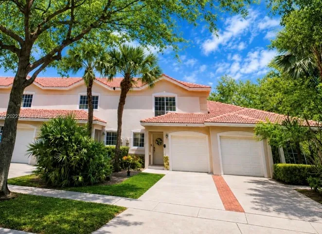 Bright updated Boynton Beach townhome with open living spaces, modern finishes, spacious bedrooms & peaceful backyard views in a resort-style community near shopping, dining & major routes.