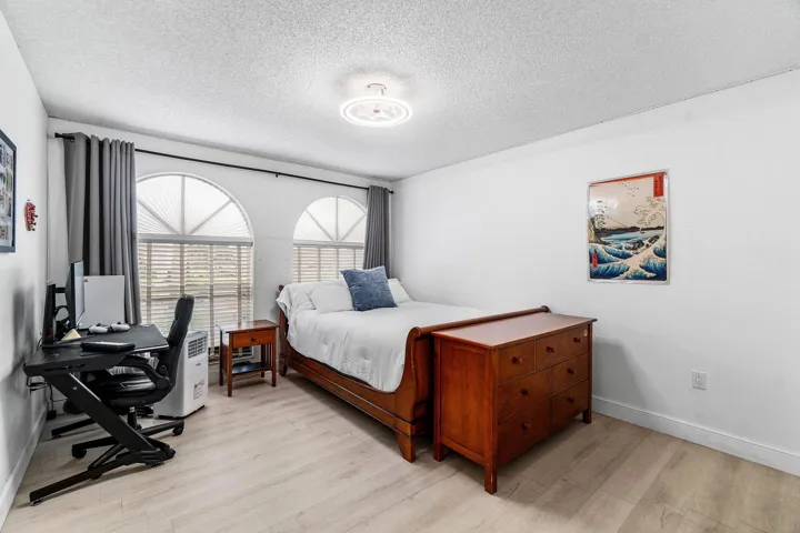 Spacious Bedroom with Arched Windows