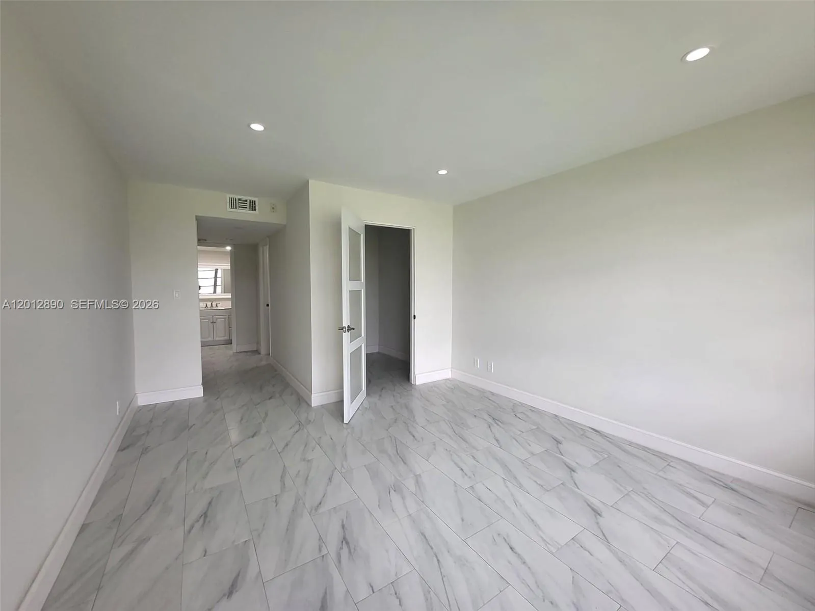 Spacious master bedroom with walk-in closet and bonus space for personal office