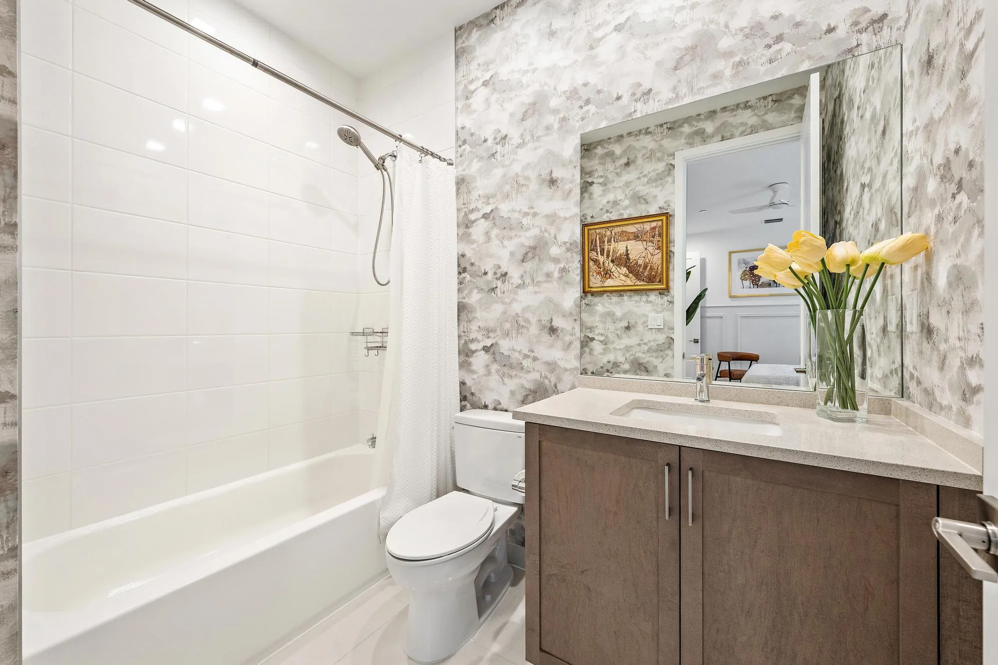 Upgraded vanity, tile, and designer wallpaper.