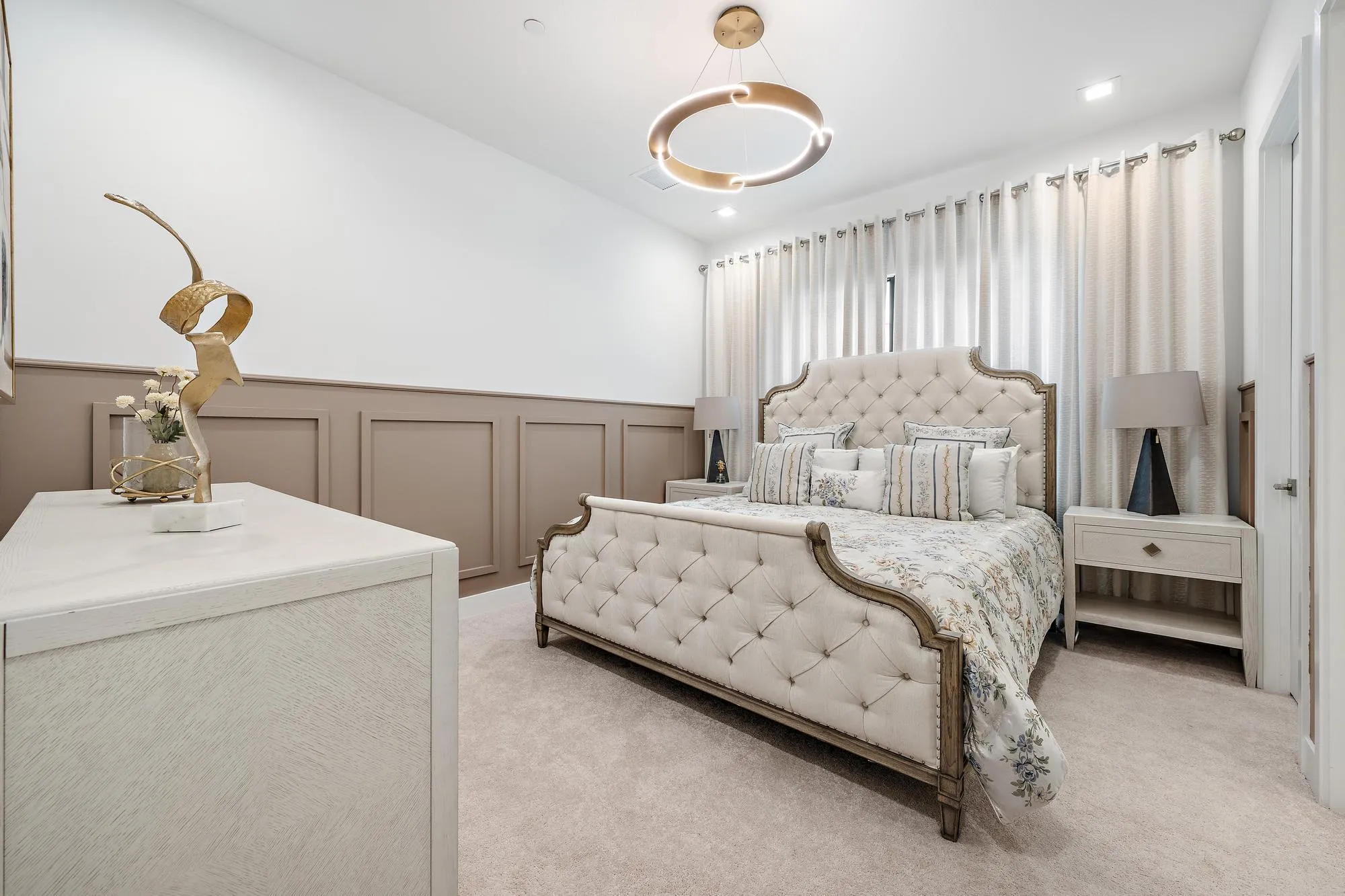 Designer lighting, decorative wall moldings, and curtains.