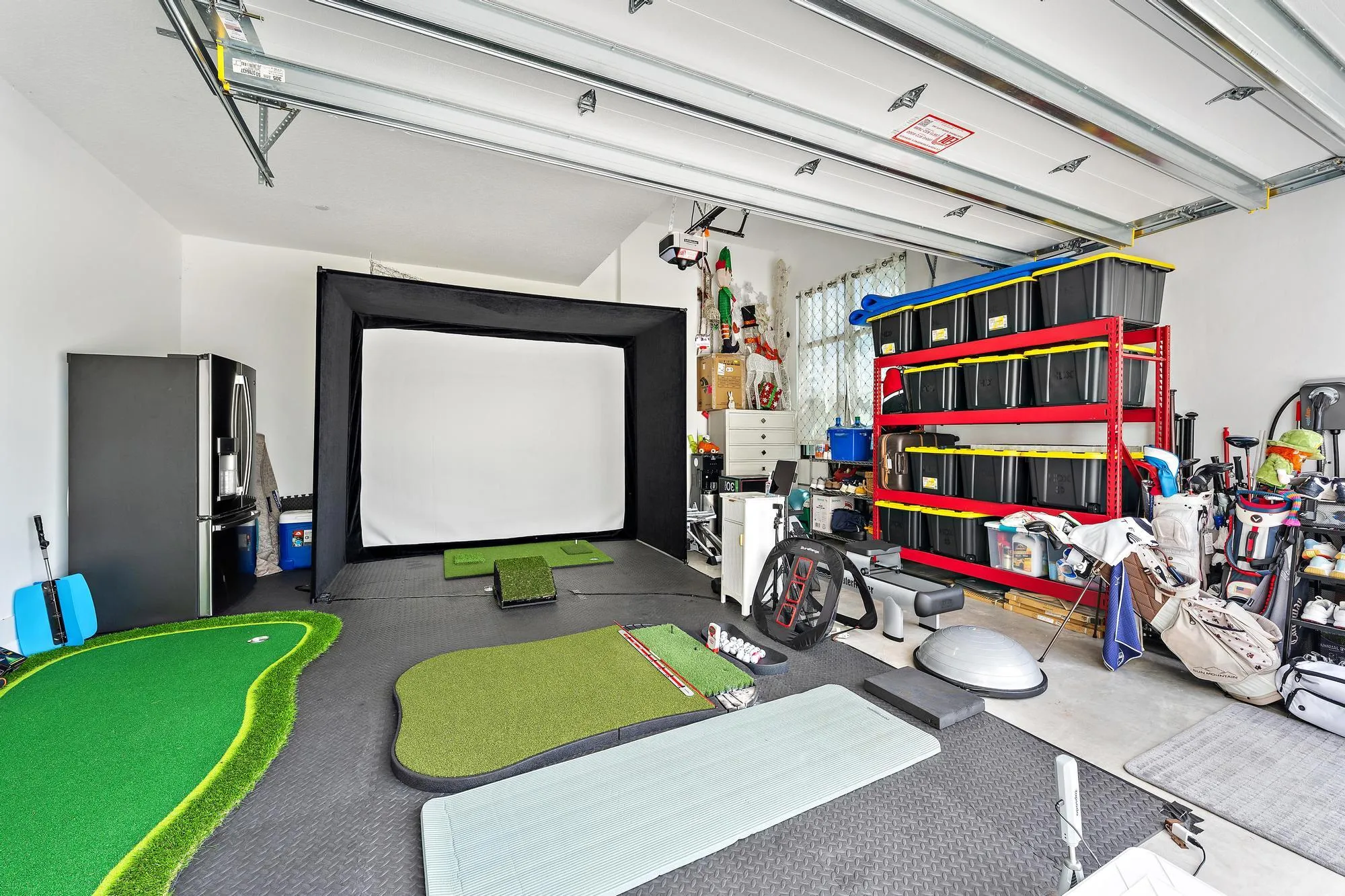 Golf simulator in one of the two garages.