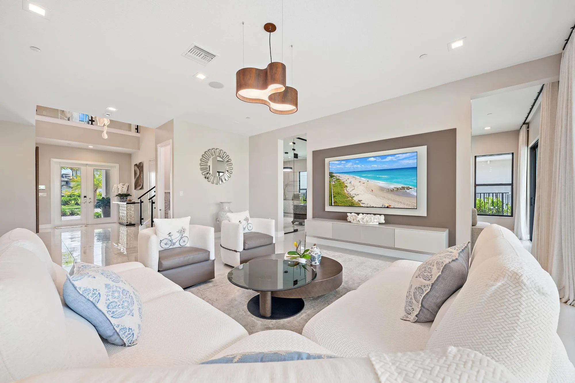 Decorative TV wall unit with built-in surround sound and ceiling-mounted speakers.