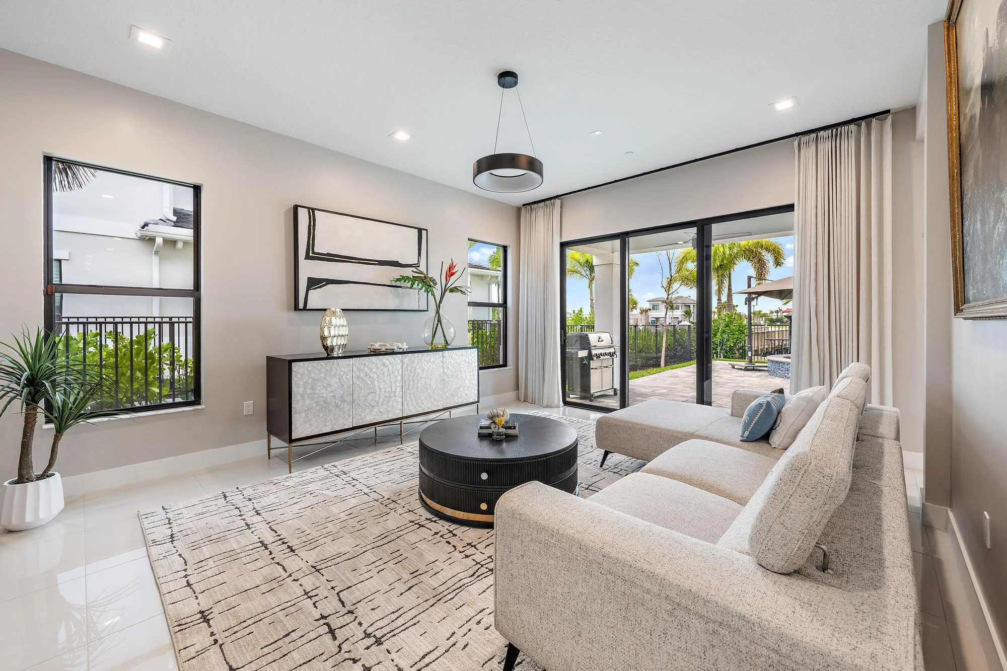 Spacious sitting room with easy access to the outdoor patio and pool.