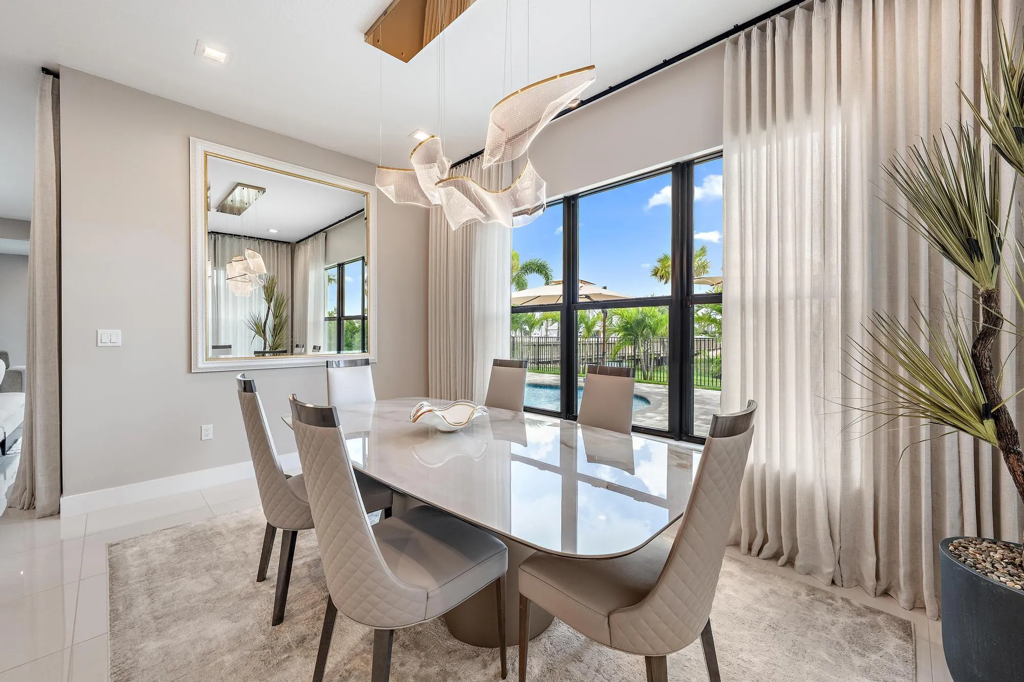 Custom high-end ceiling lighting over the casual dining table.