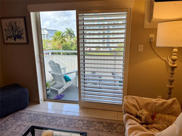 Impact Slider with Plantation Shutter that leads to oversized outdoor space on the balcony.