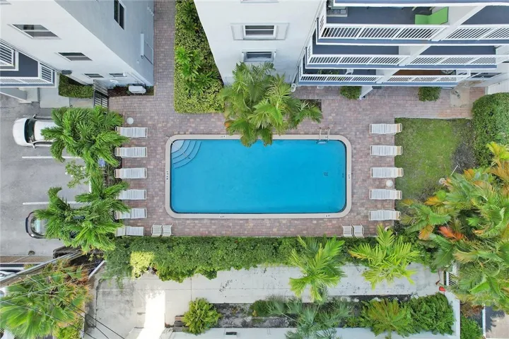 Community Pool in Tropical Setting of Leisure Sands