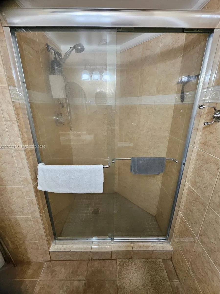 Large Walk-in Shower with Glass doors and Shower Spray Hose