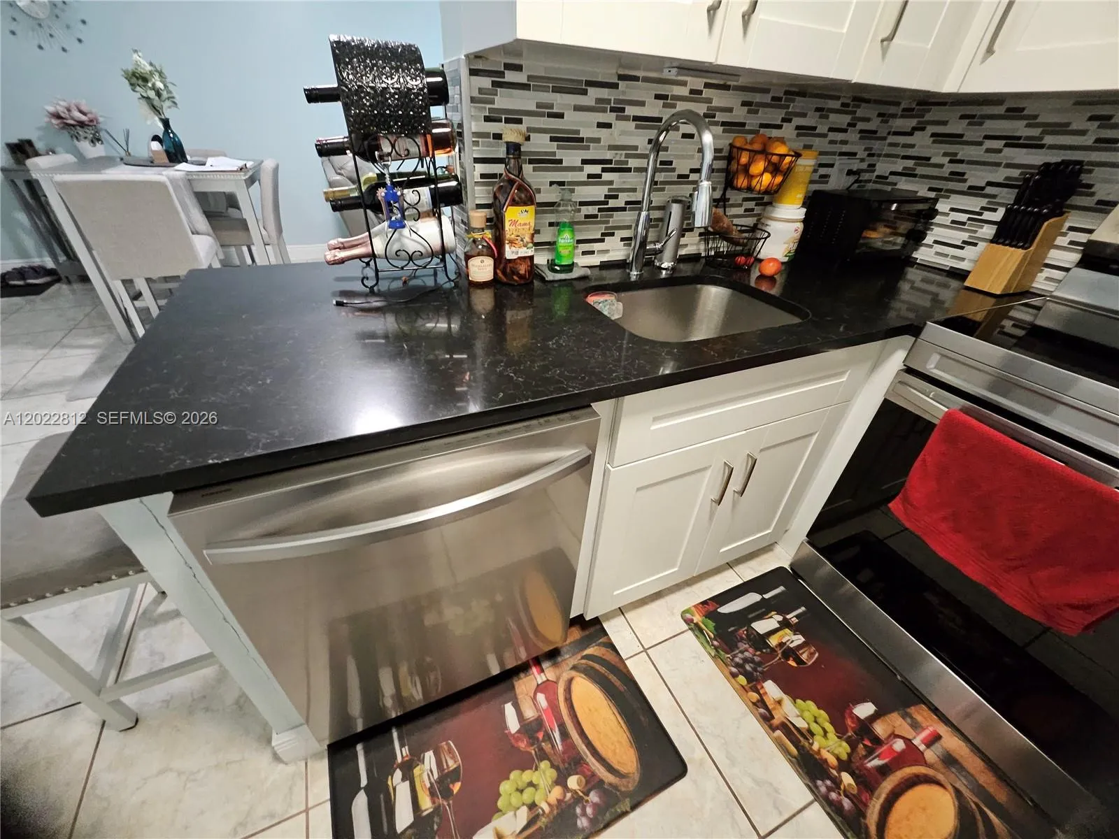 Upgraded cabinets, Granite countertops, Custom back splash and all stainless-steel appliances.