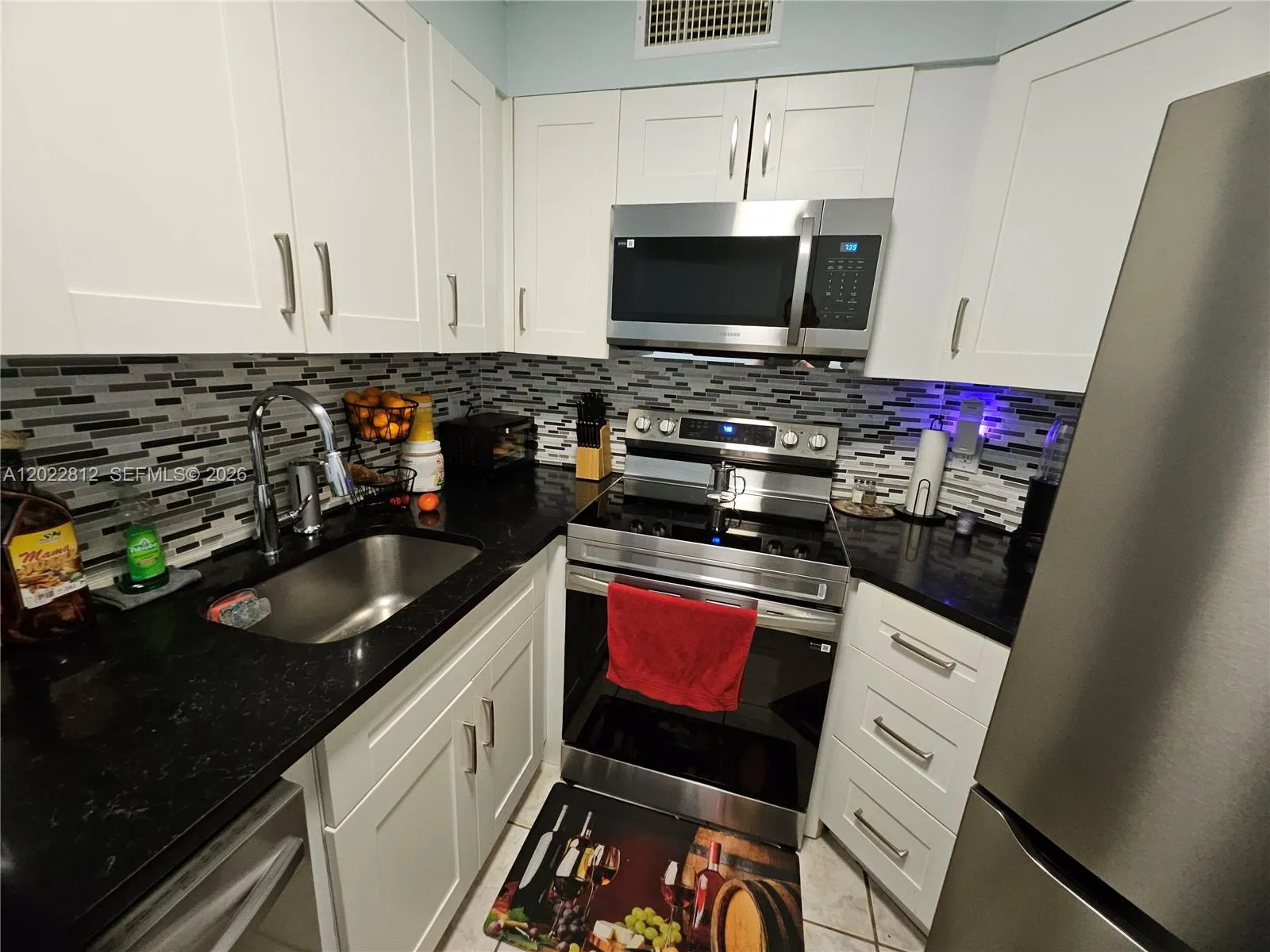 Upgraded cabinets, Granite countertops, Custom back splash and all stainless-steel appliances.