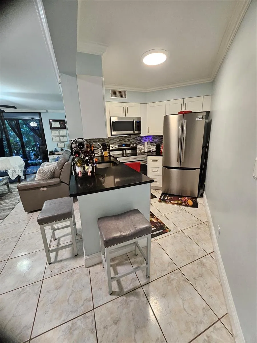 Stools are included, if wanted. Upgraded cabinets, Granite countertops, Custom back splash and all stainless-steel appliances.