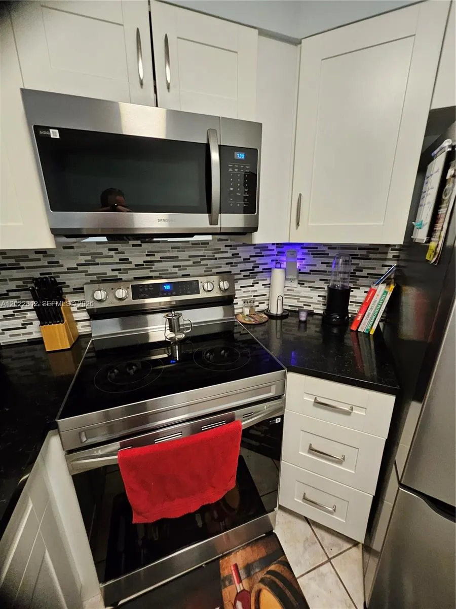 Upgraded cabinets, Granite countertops, Custom back splash and all stainless-steel appliances.