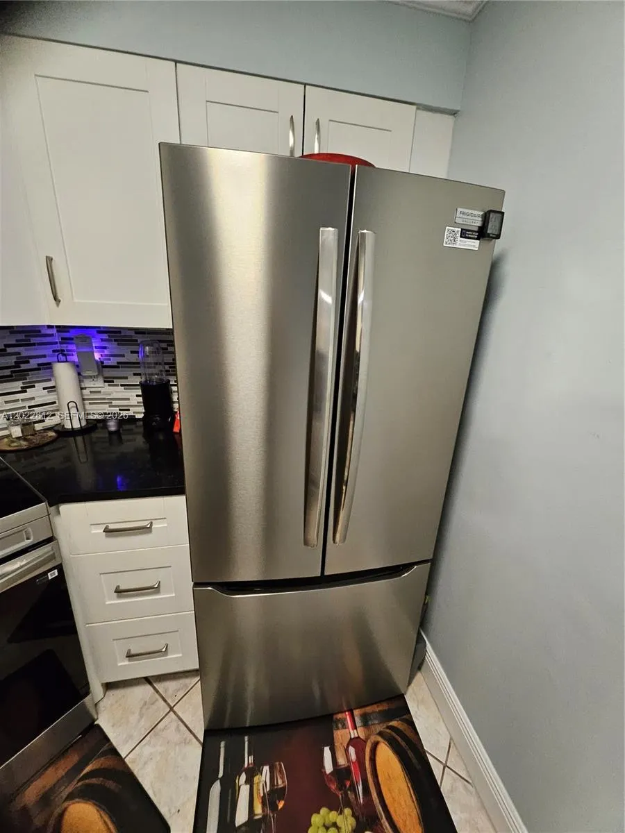 Double Door refrigerator with bottom freezer drawer. All Stainless-Steel top grade appliances