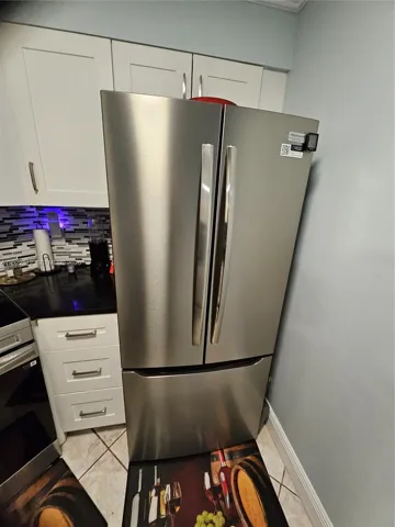 Double Door refrigerator with bottom freezer drawer. All Stainless-Steel top grade appliances