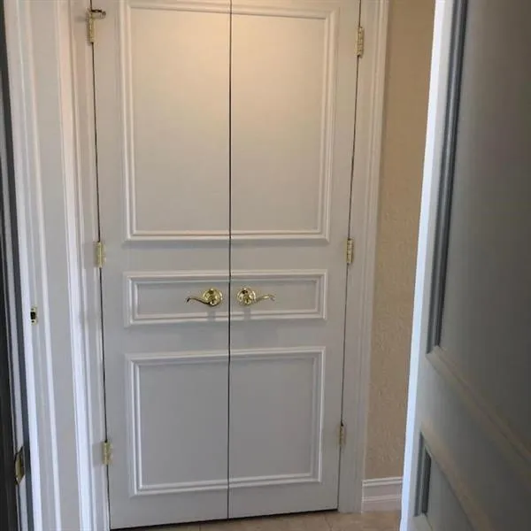 located in the hallway outside the bedrooms is stackable washer dryer
