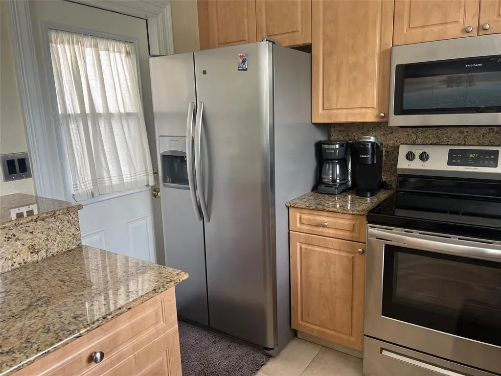 One door leads to the kitchen.