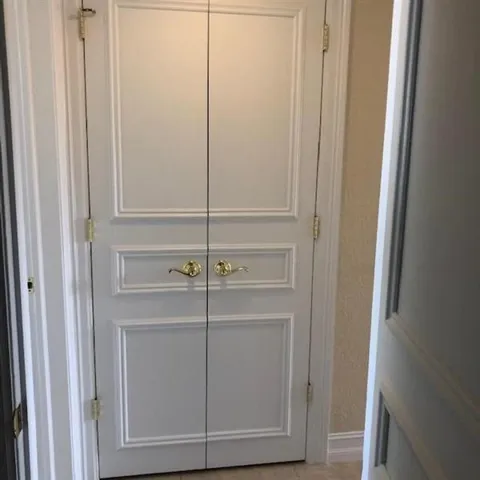 located in the hallway outside the bedrooms is stackable washer dryer