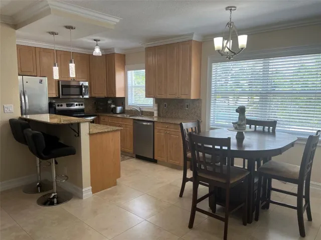 Kitchen opens to the dining area.