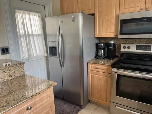 One door leads to the kitchen.