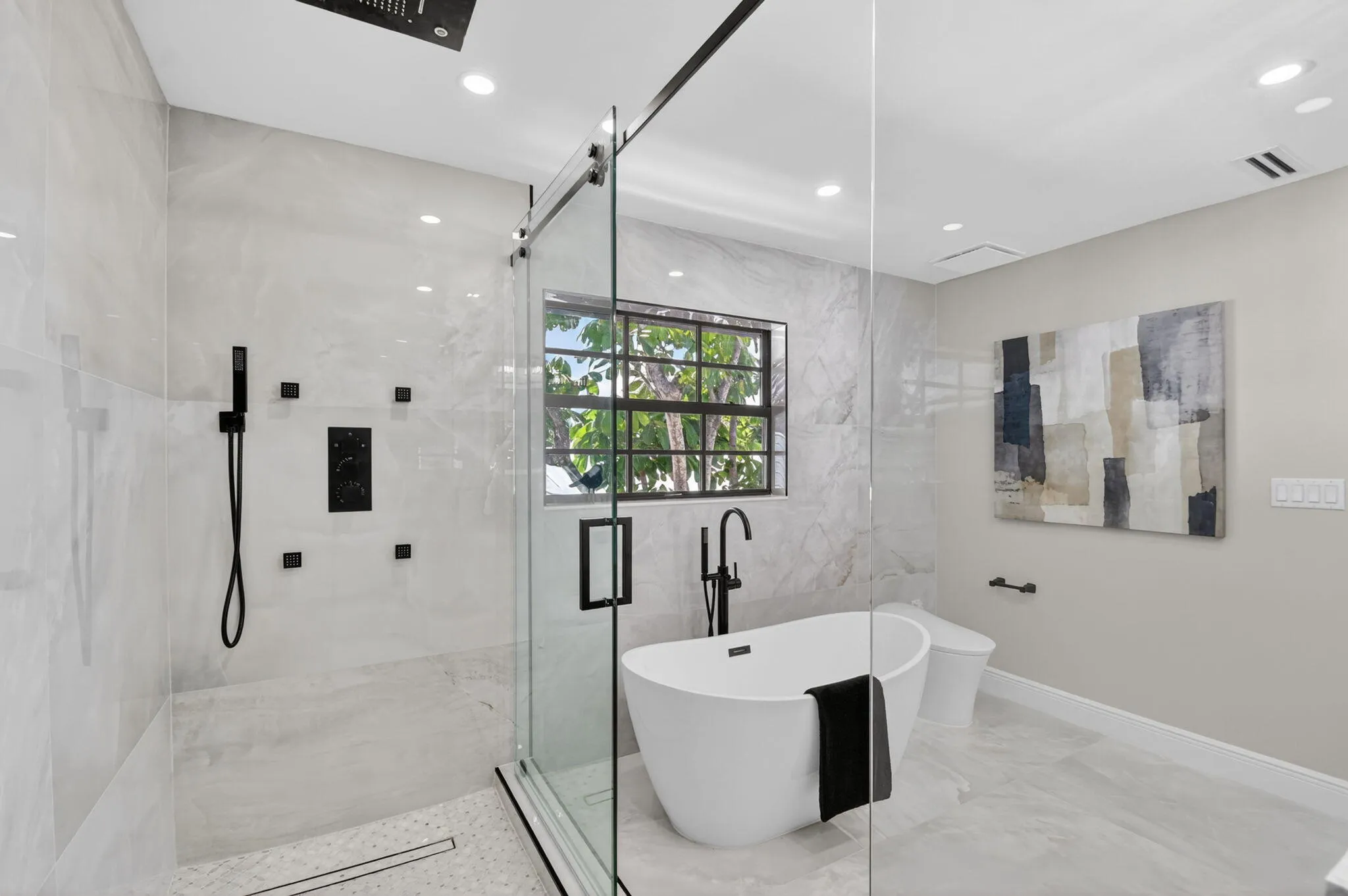 Features dual rainfall shower heads and multiple shower sprays