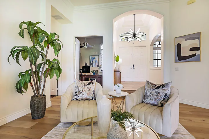 Living room viewing the front entrance doors