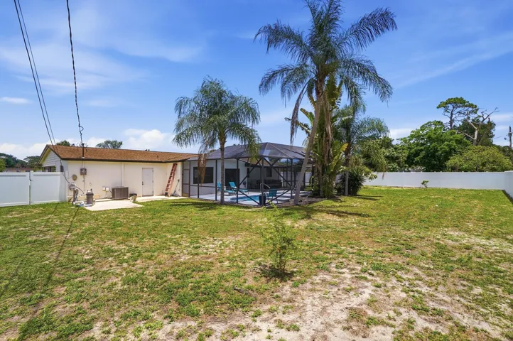 Large backyard with vinyl fence for longevity and durability