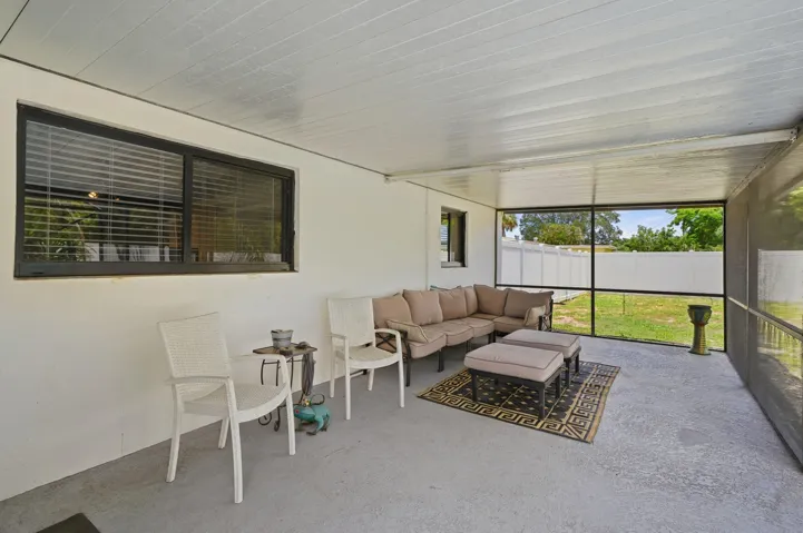 Screened patio for relaxing by the pool