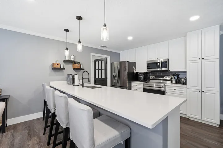 Kitchen with Stone countertops and stainless steel appliances