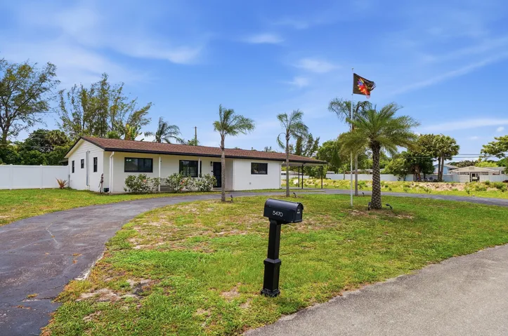 Front yard with large circular driveway