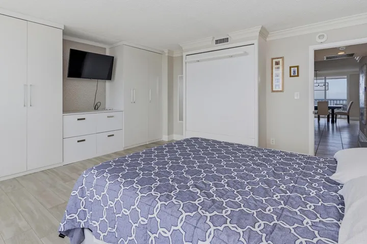 Guest Bedroom with Custom Built in Cabinetry & Murphybed