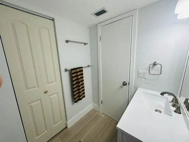 updated bathroom with linen closet