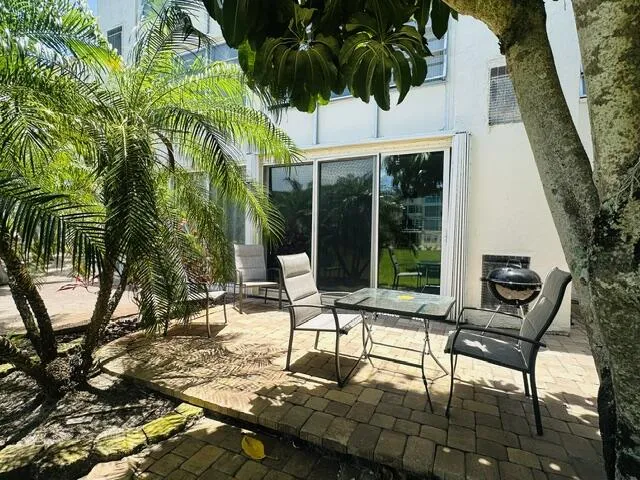 Large outdoor patio set up for entertaining- Impact sliders with Accordion shutters