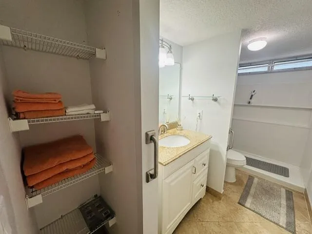 master bathroom with linen closets