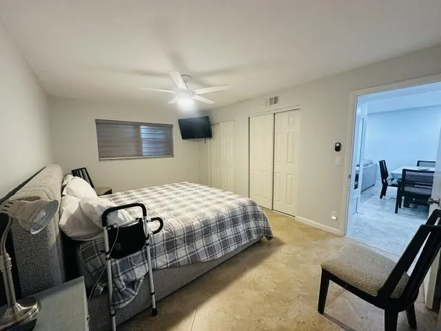 relaw in bed with big screen TV