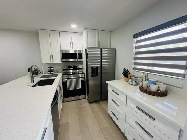 1 bedroom 1 1/2 baths, 1st floor condo Fully furnished turnkey- Full renovation,SS Appliances, Enclosed patio that opens up to a large