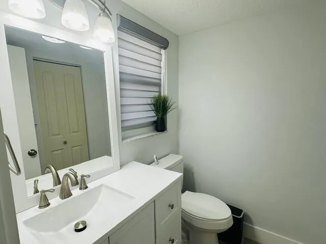 1/2 bathroom off the kitchen living room area