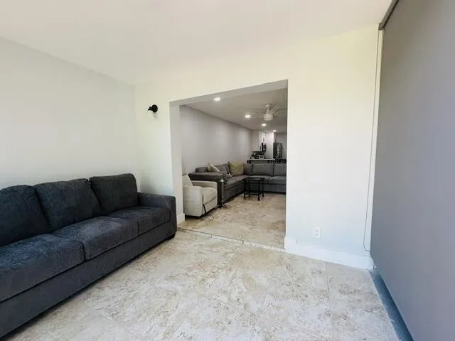 pull out couch in off living room area -impact sliders lead out to the wrap around patio -lots of light