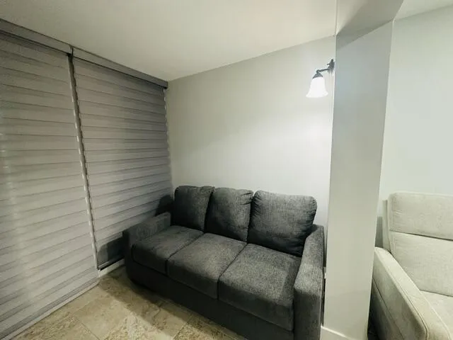 pull out couch in off living room area -impact sliders lead out to the wrap around patio -lots of light