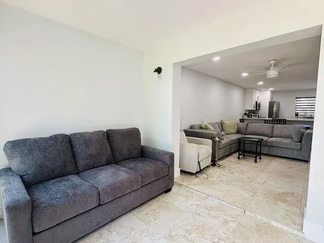 pull out couch in off living room area -impact sliders lead out to the wrap around patio -lots of light