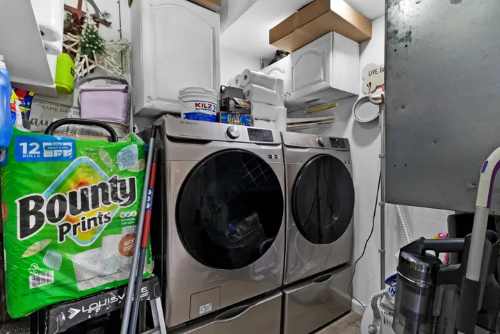Dedicated full size laundry room with newer appliances