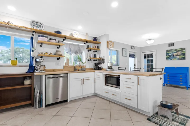 Open modern European kitchen with newer appliances
